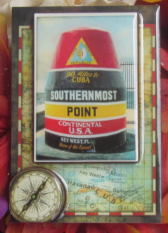 Magnet picture showing a 3D design of the Southernmost Point set on an old map and compass.