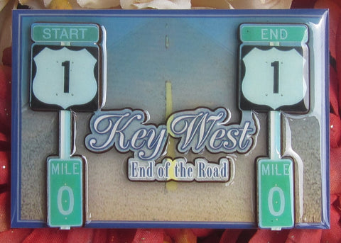 Magnet picture showing a 3D design of the US 1 "END" sign on the left and the US 1 "BEGIN" sign on the right, both with a MIle 0 sign, "Key West" and "End of the Road".