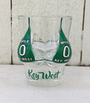 Shot glass shaped like a woman bust wearing a Mile 0 design "Key West" bikini top.