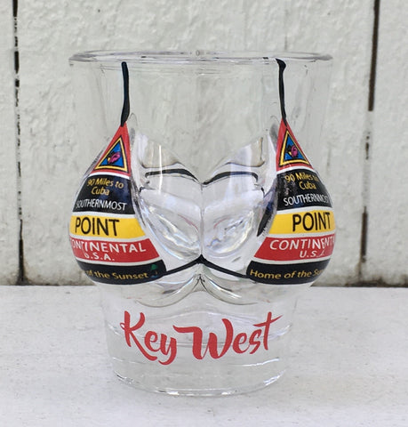 Shot glass shaped like a woman bust wearing a Southernmost Point design bikini top. With "Key West" label.