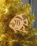 Wood ornament in the shape of a tropical angel fish. With "Key West".