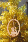 Wood ornament in the shape of a classical guitare. With "Key West".