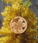 Wood ornament in the shape of an hibiscus flower. With "Key West".