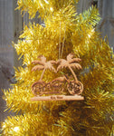 Wood ornament in the shape of a motorcycle in front of two palm trees. With "Key West".