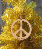 Wood ornament in the shape of the Peace Sign. With "Key West".