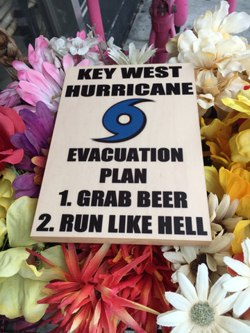 Photo on Wood 5" x 7" showing the blue hurricane logo and "KEY WEST HURRICANE EVACUATION PLAN", "1. GRAB BEER", "2. RUN LIKE HELL" (white background)