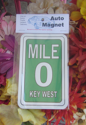 Mile 0 auto magnet pictured in its wrapper. This magnet displays the Mile 0 design sign with "KEY WEST" (green background).