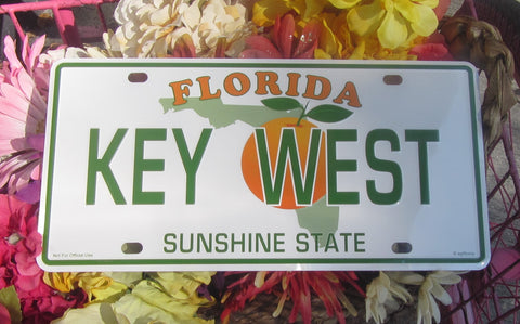 License Plate picture showing a Florida style license plate with the State picture in the background partly covered by an orange, the writting "KEY WEST" (big green letters in the middle), "FLORIDA" (smaller capital orange letters on top) and "SUNSHINE STATE" (green capital letters at the bottom).