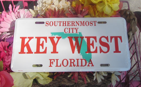 License Plate picture showing the Florida State in the background and red capital letters "SOUTHERNMOST CITY" (on top), "KEY WEST" (in the middle) and "FLORIDA" (at the bottom), with a white background.