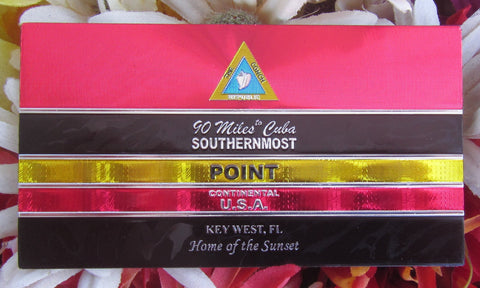 Vibrant rectangular foil magnet outlining the Southernmost Point design: conch shell logo, "90 Miles to Cuba", "Southernmost Point", "Continental USA", Key West, FL", "Home of the Sunset".