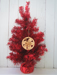 Wood ornament in the shape of an hibiscus flower. With "Key West".