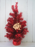 Wood ornament in the shape of a tropical angel fish. With "Key West".