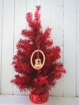 Wood ornament in the shape of a classical guitare. With "Key West".