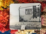 Mouse Pad showing a mid 20th century black and white picture of a "90 MILES TO CUBA" sign with an arrow pointing out to the sea and conch shells lined up on the cement, for sale at only $1 each! 