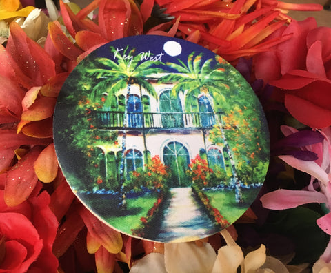 Rubber Coaster round picture showing a painting of the Hemingway House with "Key West" (white letters).