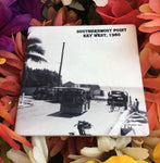 Sandstone Coaster picture showing a mid 20th century picture of a Conch Tour Train turning the corner at the Southernmost Point.