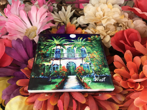 Ceramic Tile 4.25" x 4.25" picture showing a painting of the Hemingway House with "Key West" (white letters)