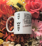 Side view mug showing part of the same front view picture, "KEY WEST" written vertically and mug handle.