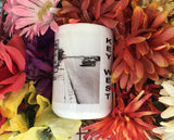 Side view mug showing part of the same front view picture and "KEY WEST" written vertically.