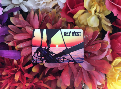  Magnet showing a beautiful sunset picture taken at the bow of a sailboat.