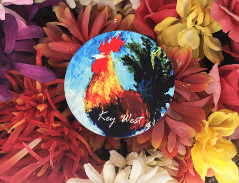 Sandstone Coaster round showing a painting of a colorful rooster with "Key West" (white letters).