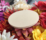 Back view of the round rubber coaster showing the rubber backing.