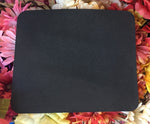 Back view of the mouse pad showing the rubber backing.