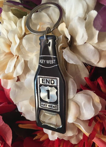 Bottle opener key chain in the shape of a bottle, with the End US 1 Key West design in gray and black.