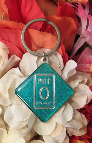 Key Chain showing a diamond shape Mile 0 design.