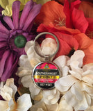 Front view of the key chain showing a design of the Southernmost Point with at the top, a triangular design showing a conch shell and "The Conch Republic" (red background), then underneath "90 Miles to Cuba" and "SOUTHERNMOST" with a black background, then underneath "POINT" with a yellow background, then underneath "CONTINENTAL U.S.A." with a red background and finally at the bottom "KEY WEST, FL" with a black background.