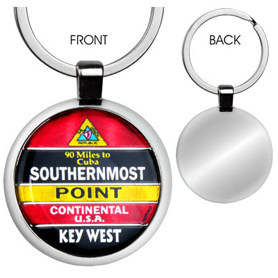 Front and back view of the key chain. The front view shows a design of the Southernmost Point with at the top, a triangular design showing a conch shell and "The Conch Republic" (red background), then underneath "90 Miles to Cuba" and "SOUTHERNMOST" with a black background, then underneath "POINT" with a yellow background, then underneath "CONTINENTAL U.S.A." with a red background and finally at the bottom "KEY WEST, FL" with a black background. The back view shows a plain shinny gray.