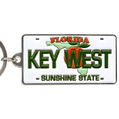 Key Chain showing a Florida license plate design with the map of Florida covered by an orange with leaf, "FLORIDA" on top, "KEY WEST" in the middle and "SUNSHINE STATE" at the bottom.