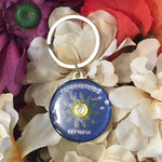 Key Chain showing a round Conch Republic flag design.