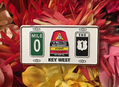 Magnet showing from left to right: the Mile 0 sign, the Southernmost Point, and the US 1 End sign. With "Key West".