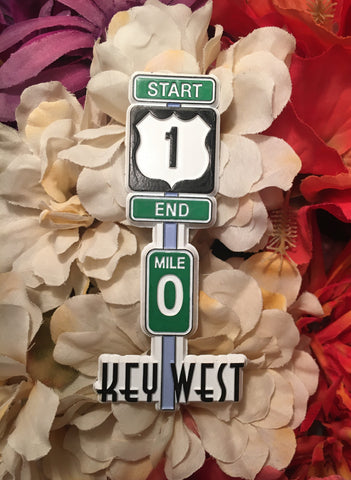 Magnet in the shape of the US 1 pole with: :Start", "End", Mile 0" and "Key West".