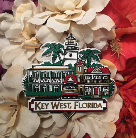 Magnet showing the Southernmost Point, the Hemingway House, the Southernmost House and the Lighthouse. With "Key West, Florida" in gold letters.