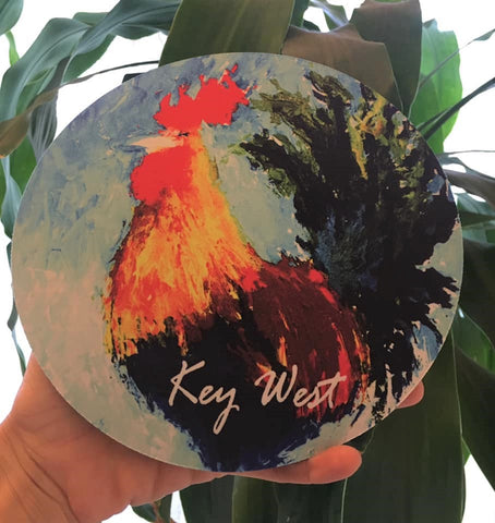 Mouse pad showing a painting of a colorful rooster with "Key West" (white letters).