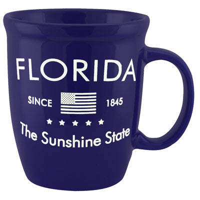 Mug picture showing "FLORIDA" on top, the American flag and "SINCE 1845" in the middle, "The Sunshine State" at the bottom, with a royal blue background.