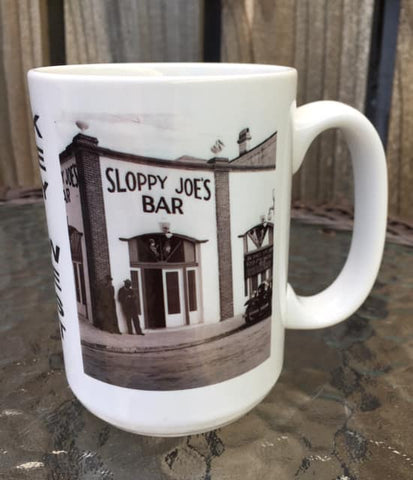 Side view mug showing a mid 20th century picture of Sloppy Joe's Bar and the mug handle.