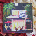 Rubber Coaster showing the painting of a couple seating outdoors at Pepe's with two roosters standing by the restaurant's door.