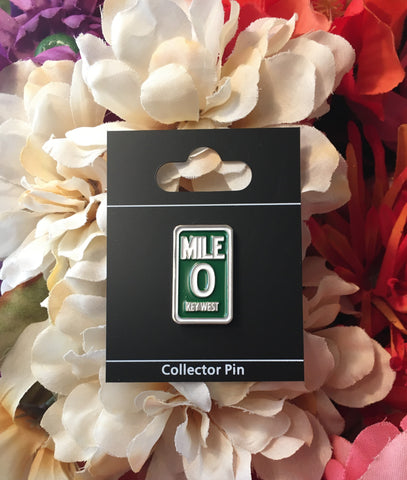 Pin on display card "Collector Pin" showing the design of the Mile 0 sign with a dark green background (like the original street sign)