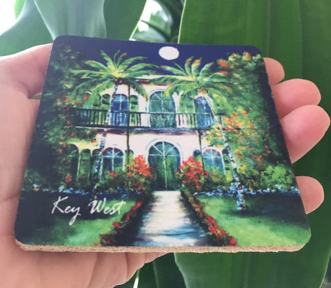Rubber Coaster picture showing a painting of the Hemingway House with "Key West" (white letters).