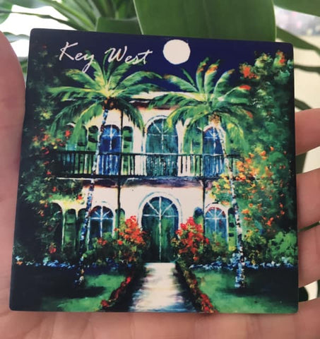 Sandstone coaster picture showing a painting of the Hemingway House with "Key West" (white letters).