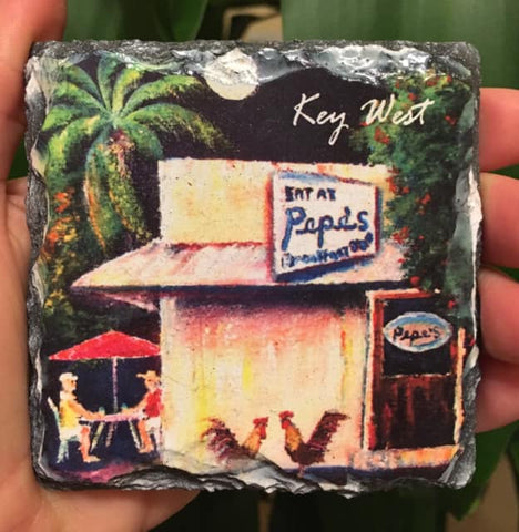 Slate Coaster showing the painting of a couple seating outdoors at Pepe's with two roosters standing by the restaurant's door.
