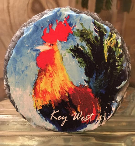 Slate Coaster round showing a painting of a colorful rooster with "Key West" (white letters).