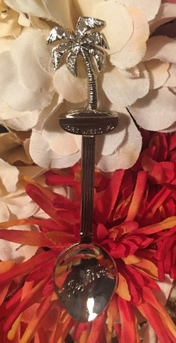 Souvenir spoon whose top is shaped like a palm tree. With "Key West".