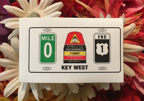 Mini sticker showing the Mile 0 sign, the Southernmost Point, the US 1 End sign and "Key West".