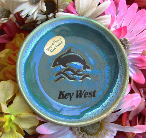 Blue color glaze dish showing a jumping dolphin, with "Key West".