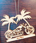 Wood ornament in the shape of a motorcycle in front of two palm trees. With "Key West".