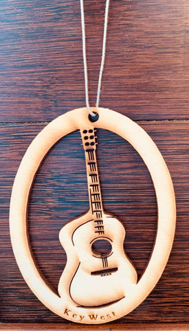 Wood ornament in the shape of a classical guitare. With "Key West".